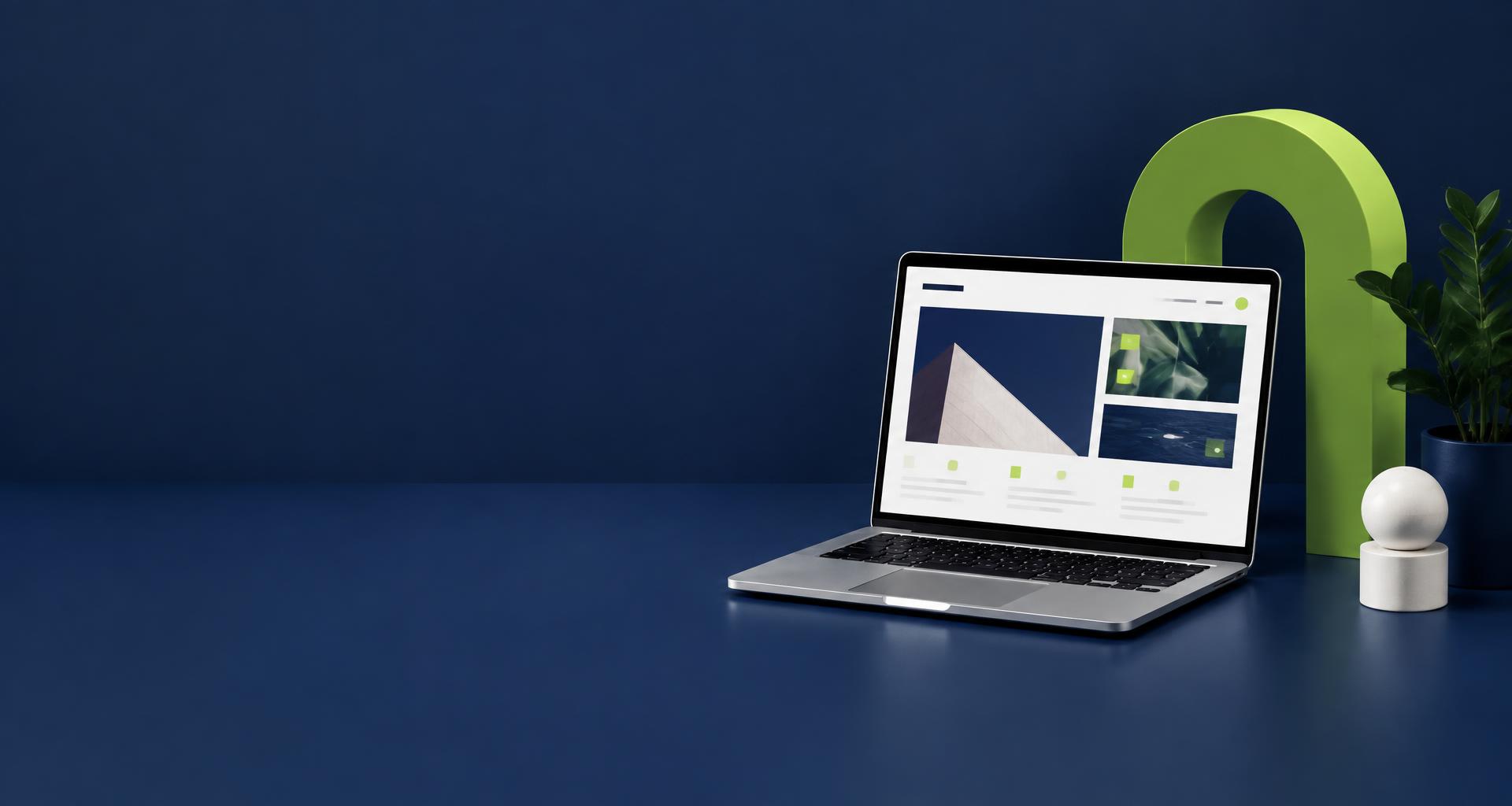 Website design concept on a laptop in a navy and lime studio
